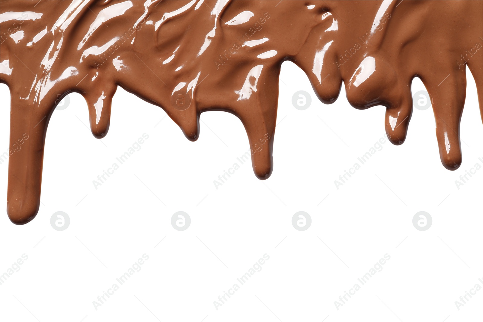 Photo of Tasty melted milk chocolate pouring down on white background