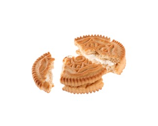 Photo of Broken tasty sandwich cookie with cream on white background