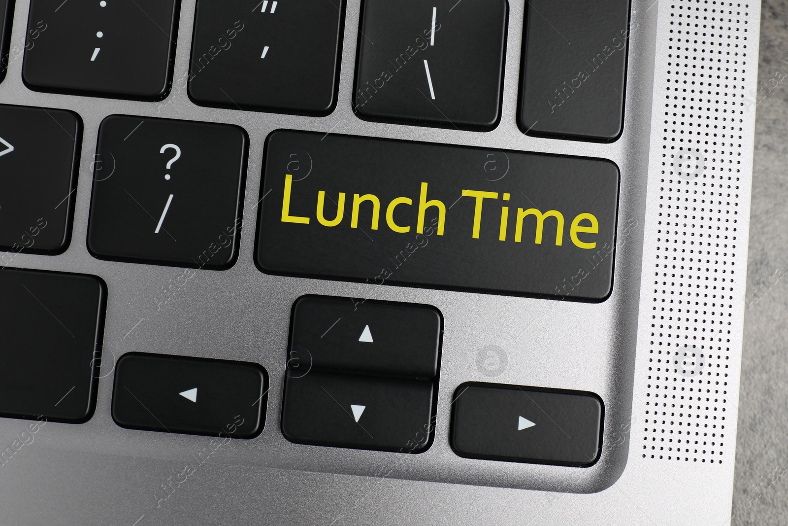 Image of Business lunch concept. Laptop with Lunch Time button, top view