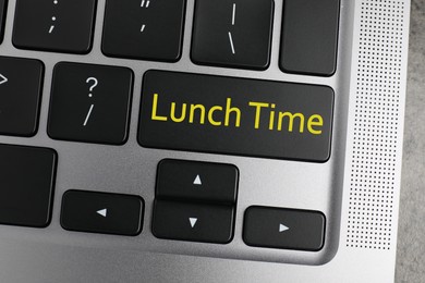 Business lunch concept. Laptop with Lunch Time button, top view