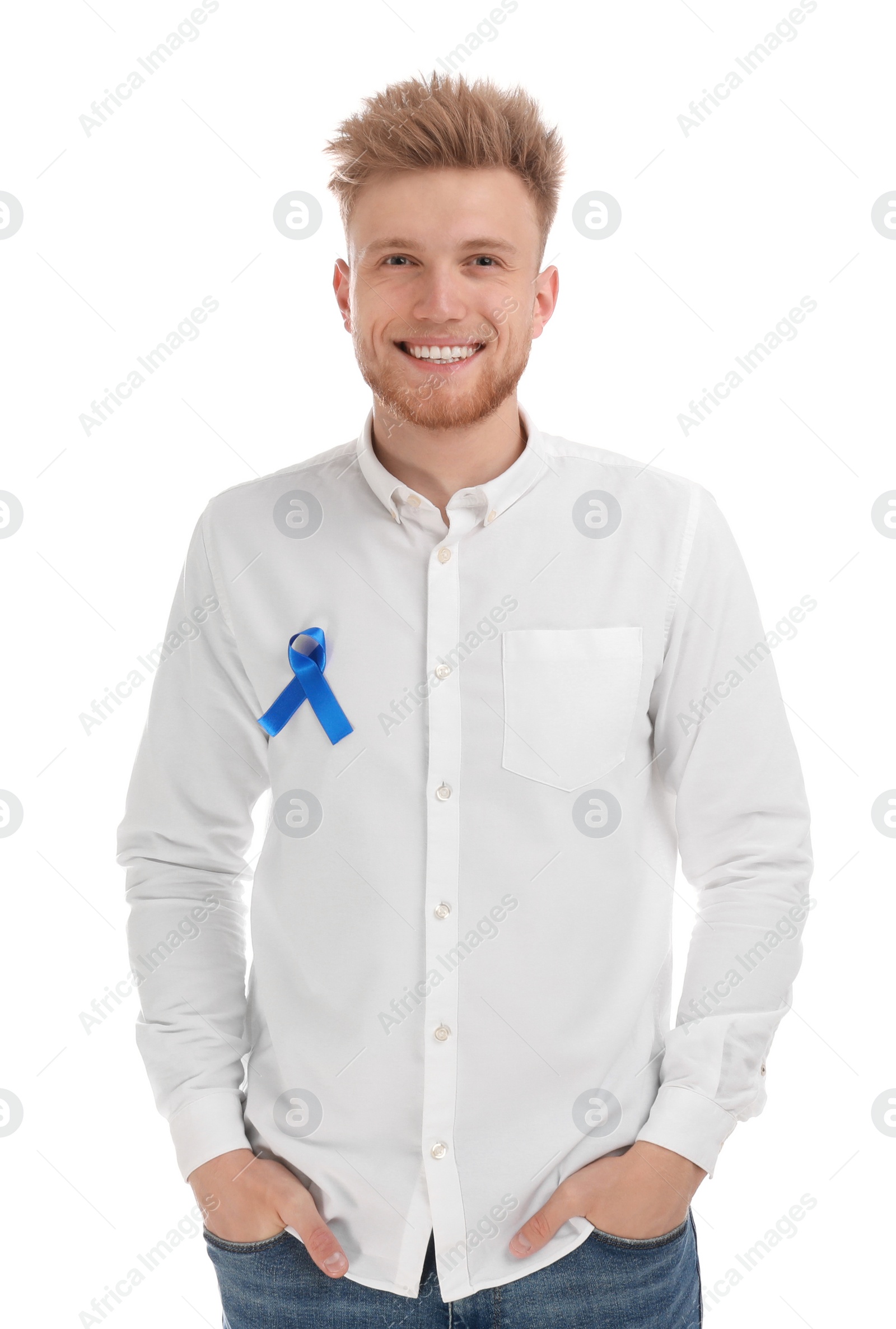 Photo of Young man with blue ribbon on white background. Urology cancer awareness