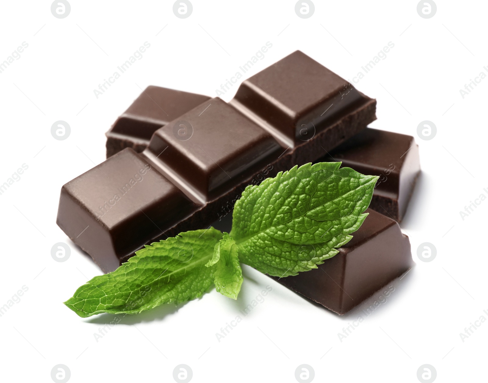 Photo of Pieces of dark chocolate with mint on white background