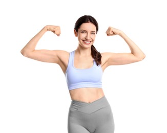 Photo of Happy young woman with slim body showing muscles on white background