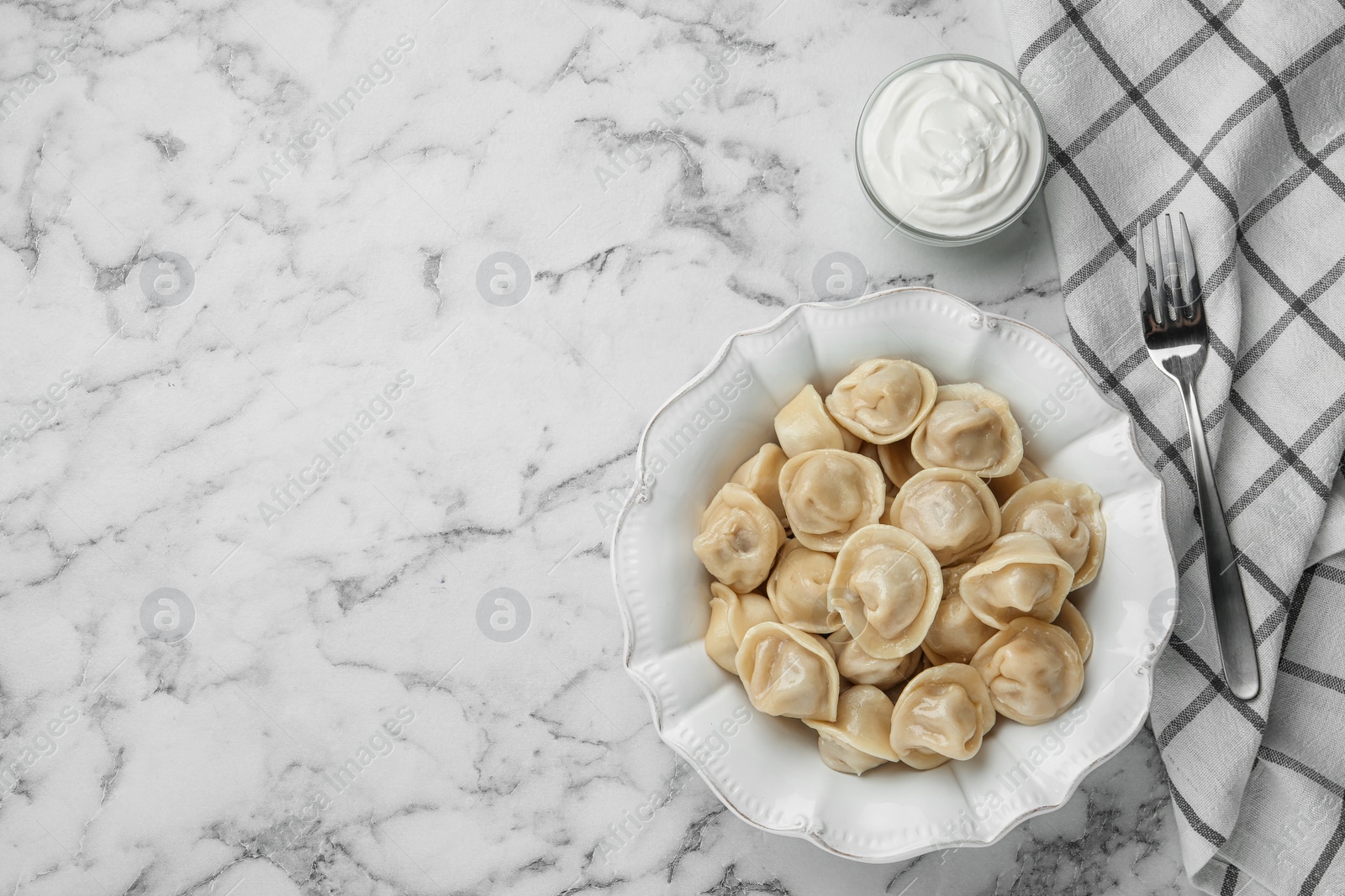 Photo of Flat lay composition with tasty dumplings on marble table, flat lay. Space for text