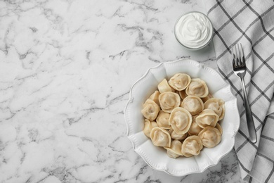 Flat lay composition with tasty dumplings on marble table, flat lay. Space for text