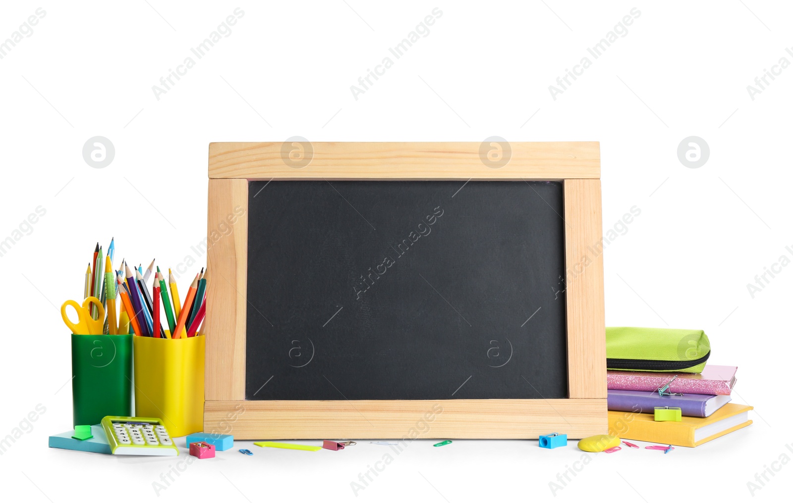 Photo of Different school stationery and small blank chalkboard on white background. Space for text