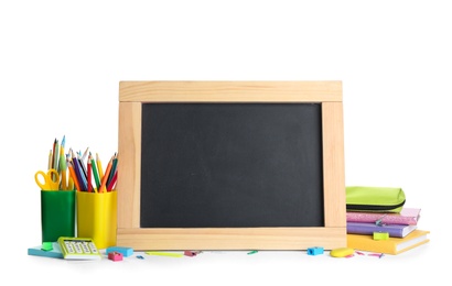 Different school stationery and small blank chalkboard on white background. Space for text