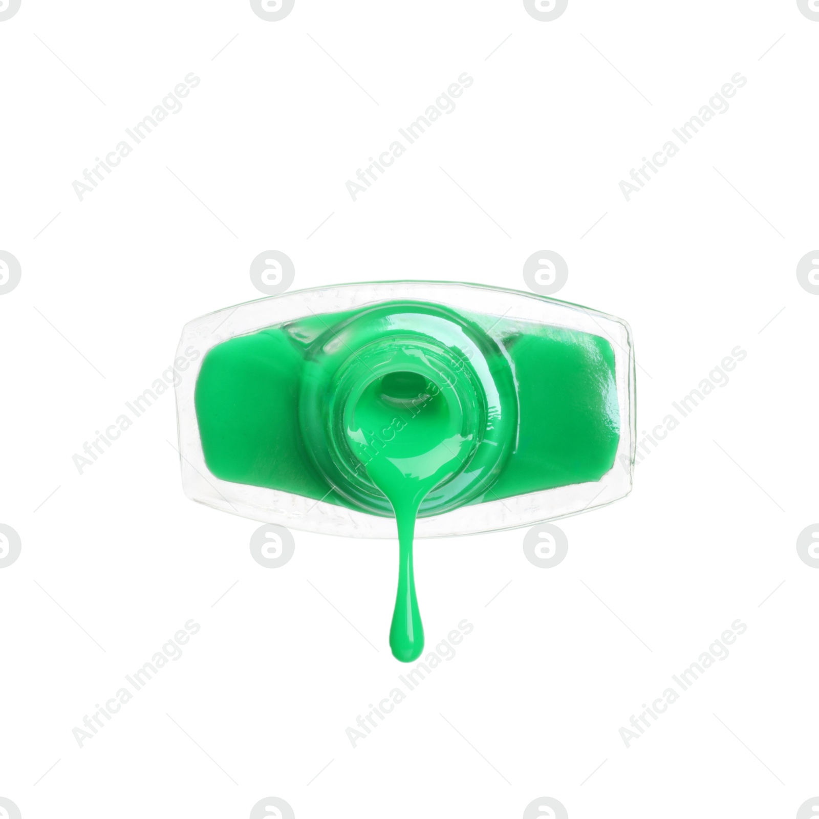 Photo of Green nail polish dripping from bottle isolated on white