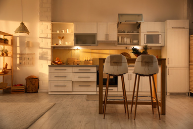 Modern kitchen interior with stylish wooden table