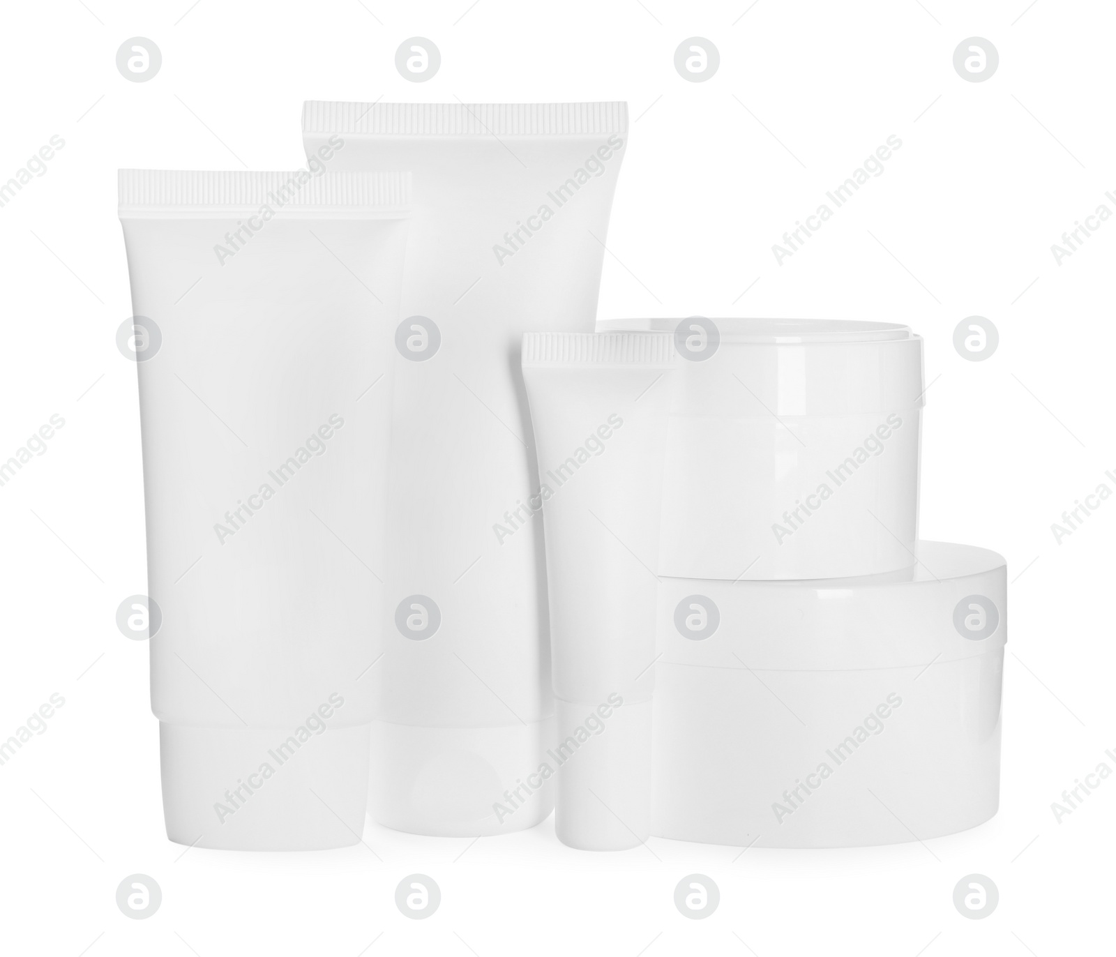 Photo of Blank tubes and jars of cosmetic products on white background