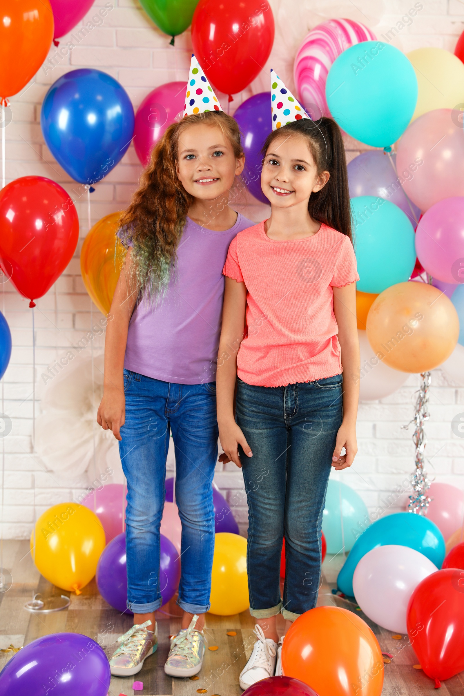 Photo of Happy children near bright balloons at birthday party indoors