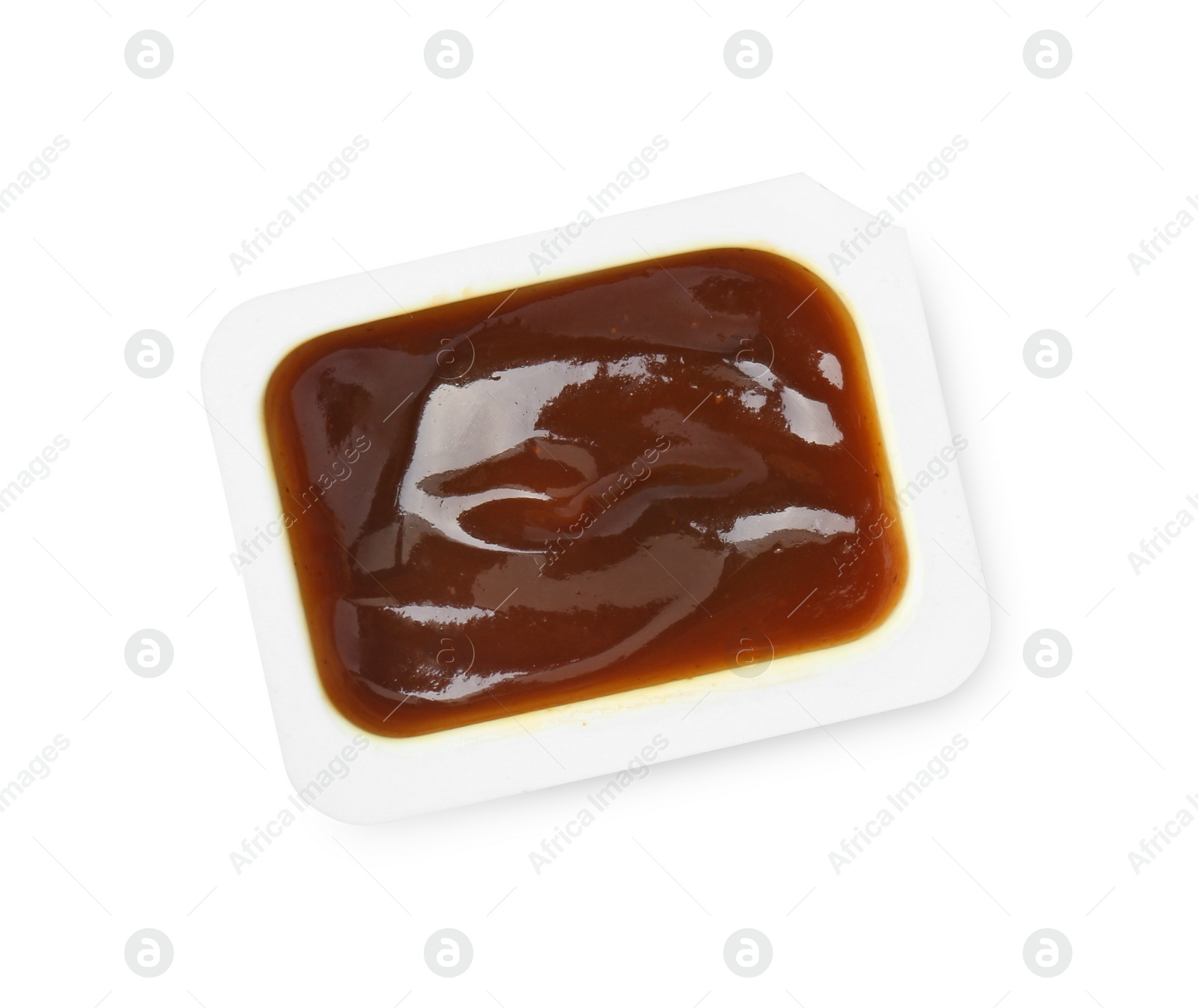 Photo of Tasty barbecue sauce in plastic container isolated on white, top view