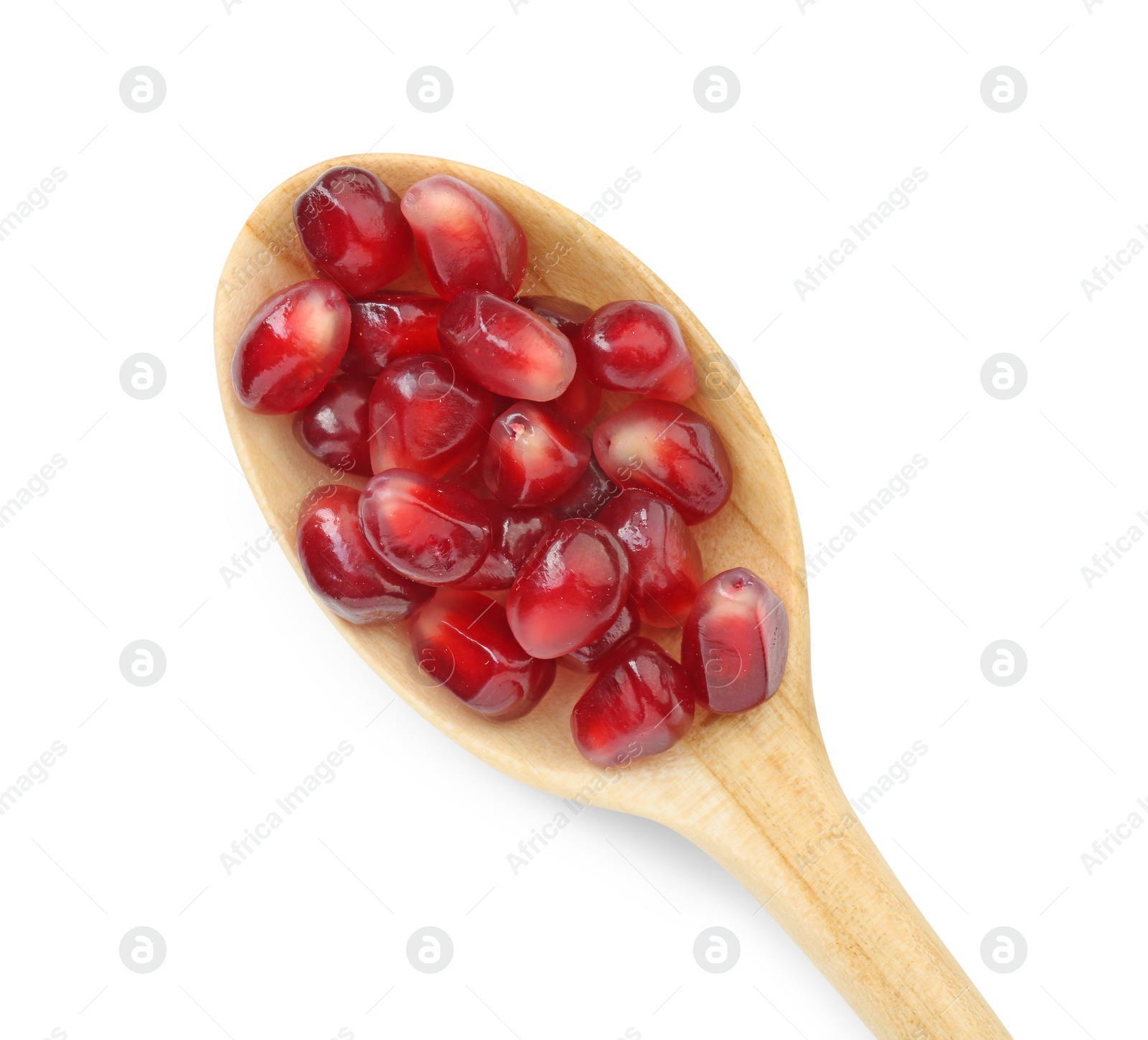 Photo of Ripe juicy pomegranate grains in wooden spoon isolated on white, top view