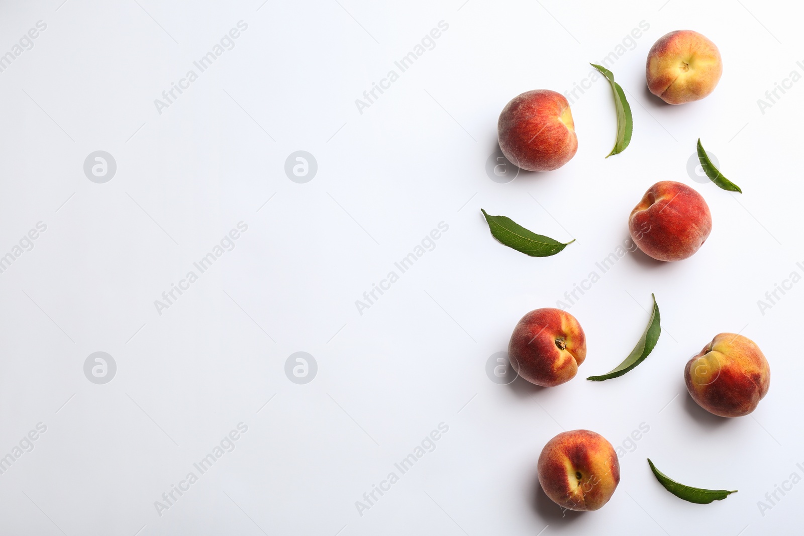 Photo of Composition with fresh peaches on white background, top view