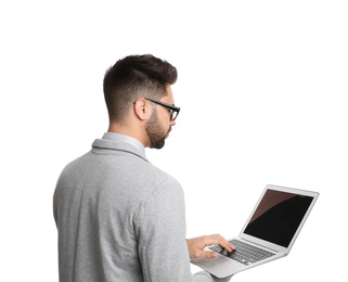 Photo of Young businessman with laptop on white background