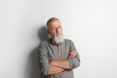 Portrait of handsome senior man on white background