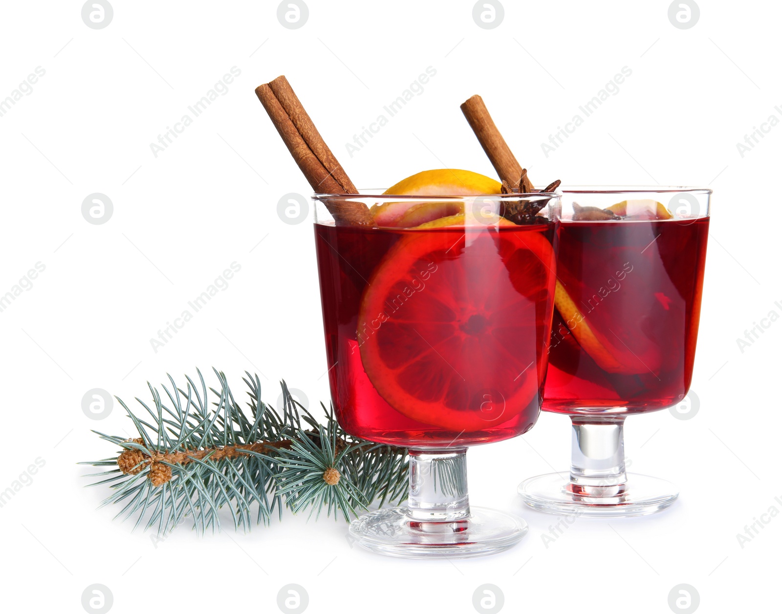 Photo of Glasses with red mulled wine on white background