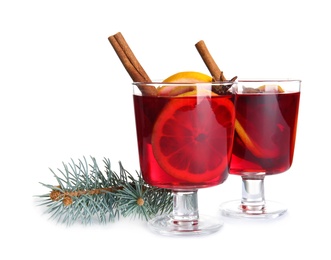 Photo of Glasses with red mulled wine on white background