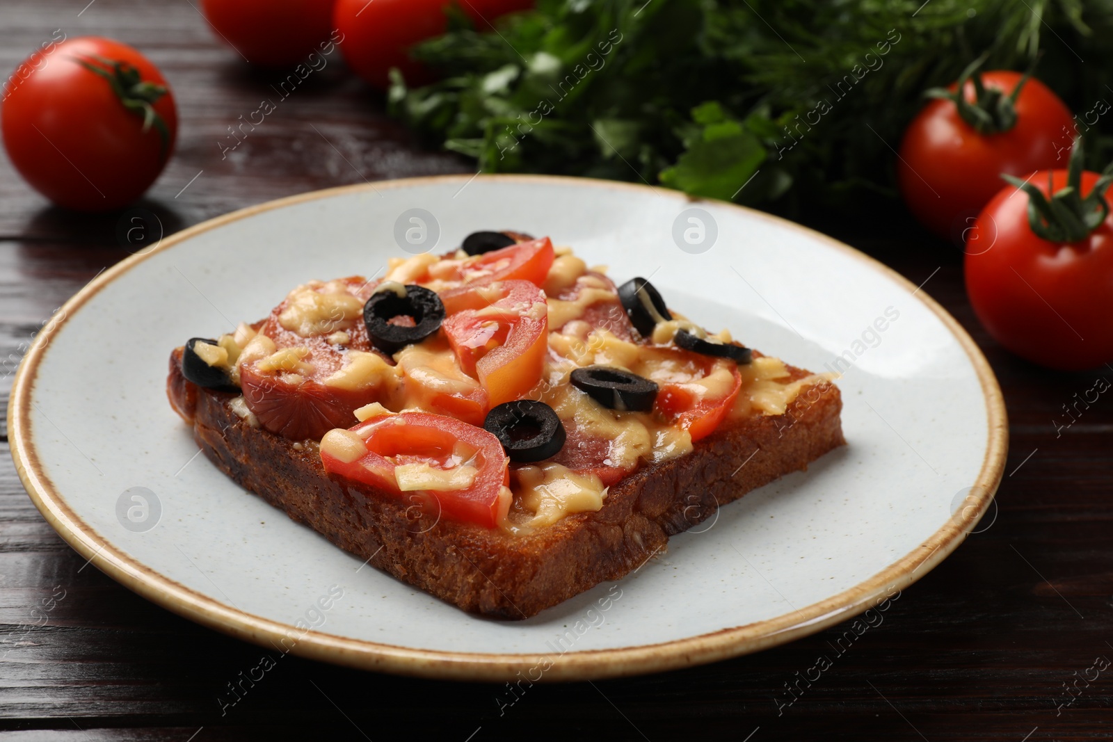 Photo of Tasty pizza toast on wooden table, closeup