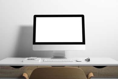 Photo of Workplace with modern computer and smartphone on white table. Mockup for design