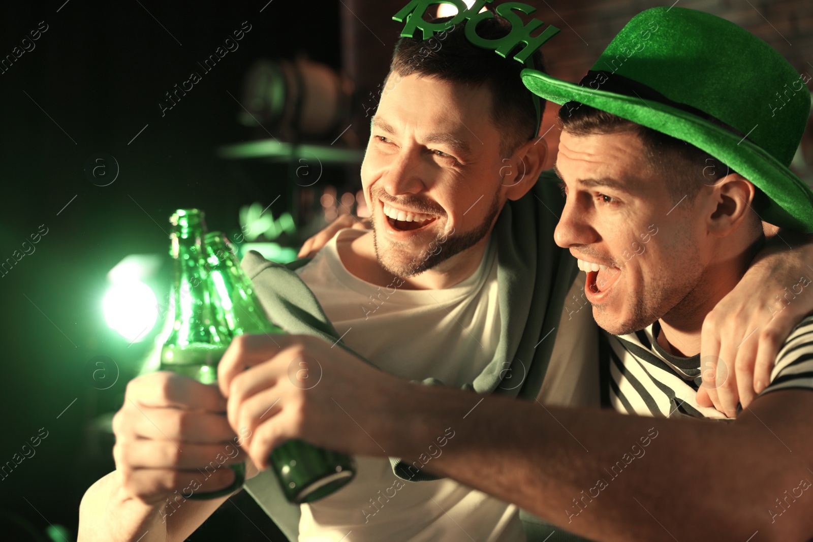 Photo of Men with beer celebrating St Patrick's day in pub