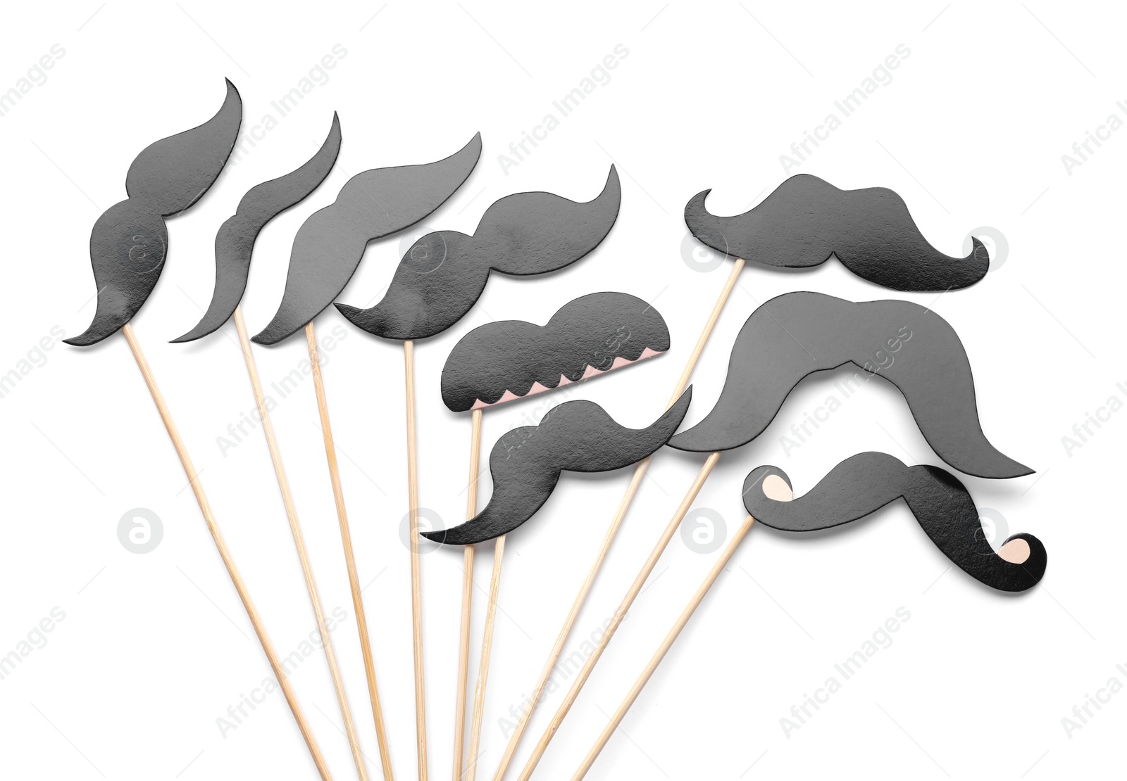 Photo of Fake paper mustaches with party props isolated on white, top view