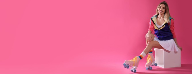Young woman with retro roller skates on pink background, space for text. Banner design