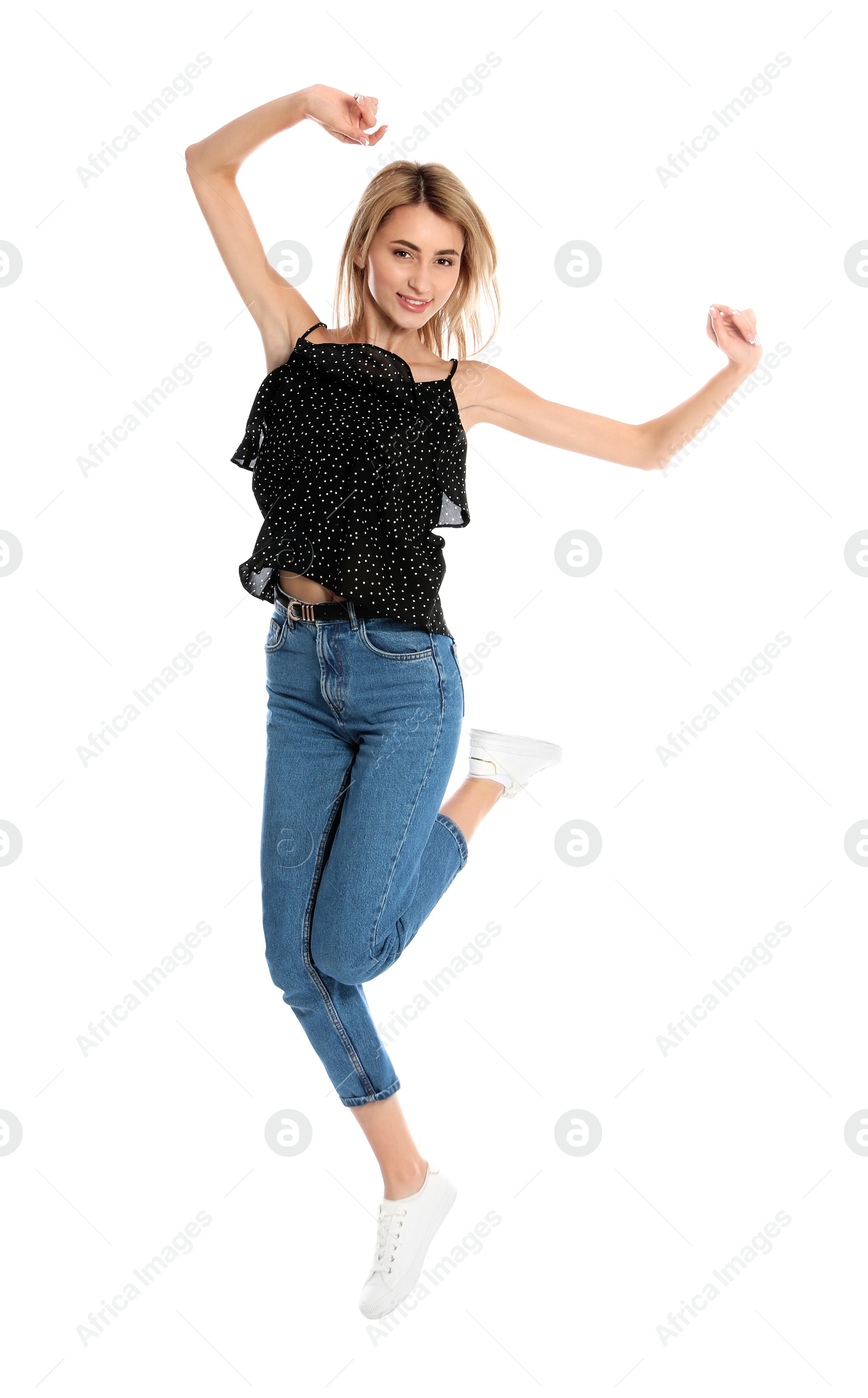 Photo of Beautiful young woman jumping on white background