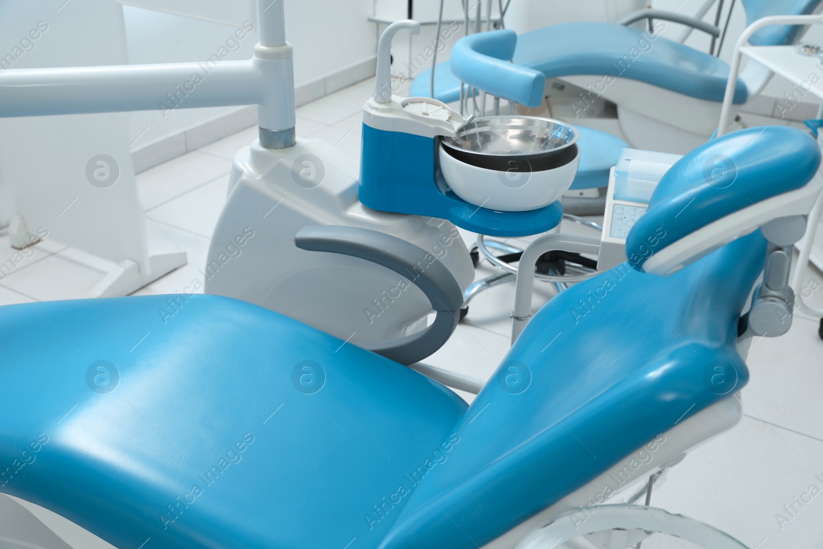 Photo of Dentist's office interior with chair and modern equipment