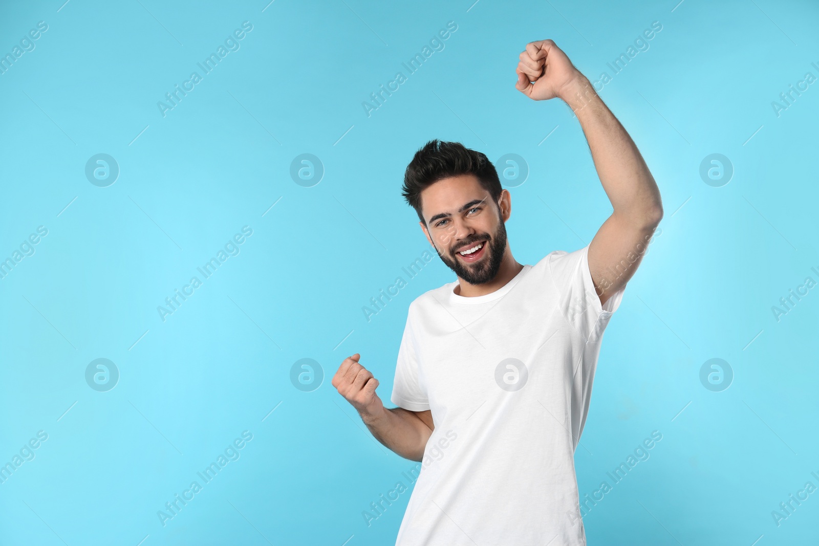 Photo of Portrait of happy young man on color background. Space for text