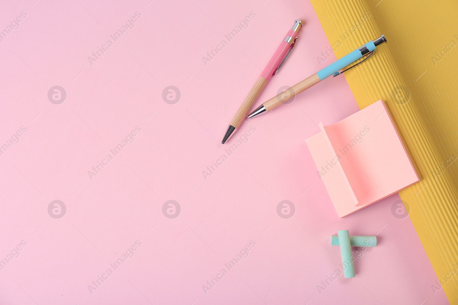 Photo of Composition with pens and sticky notes on color background, top view. Space for text