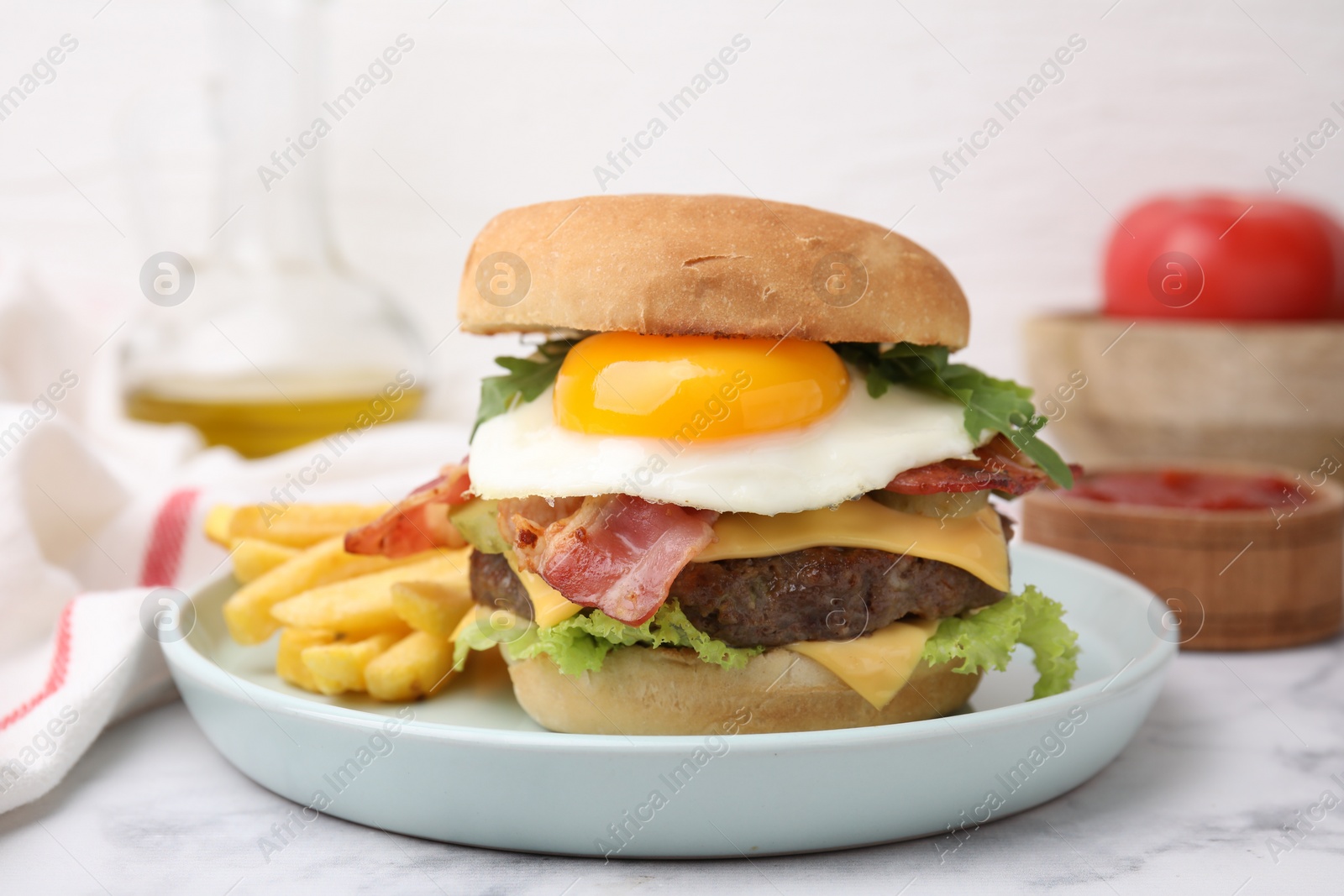 Photo of Delicious burger with fried egg and french fries served on white marble table, closeup