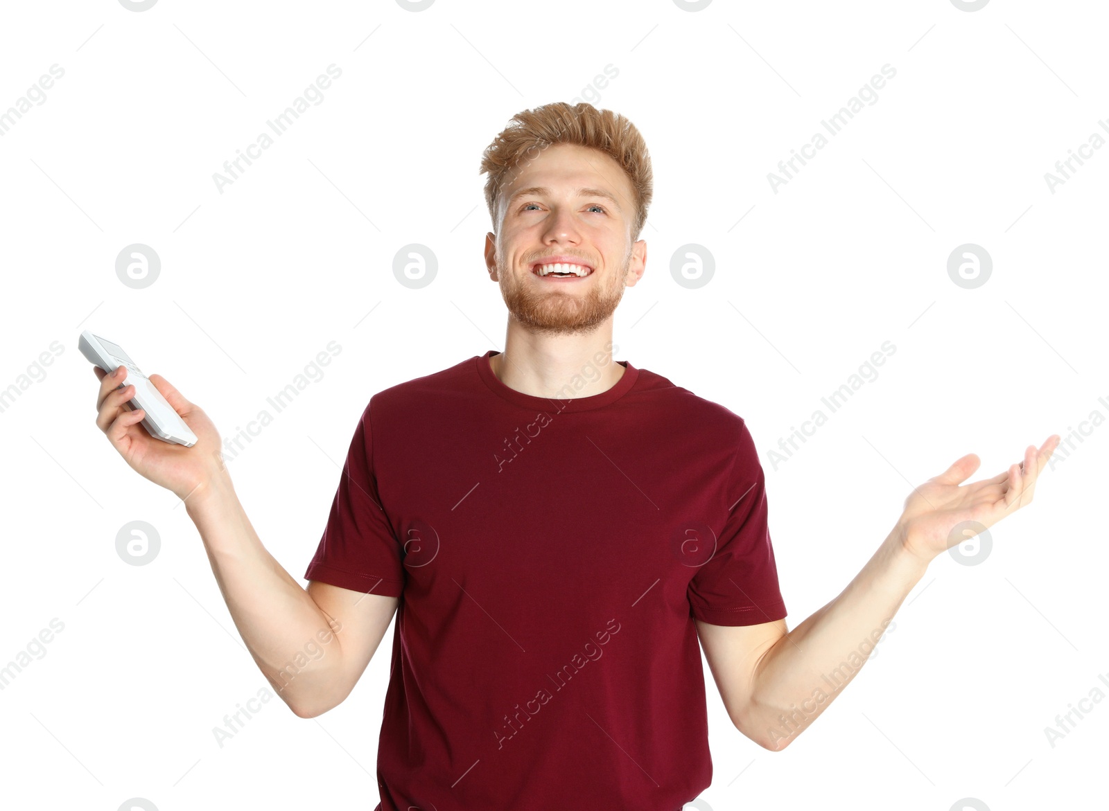 Photo of Young man with air conditioner remote on white background