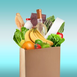 Image of Paper bag with different products and receipt on light blue background