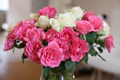 Photo of Beautiful bouquet of roses on blurred background, closeup