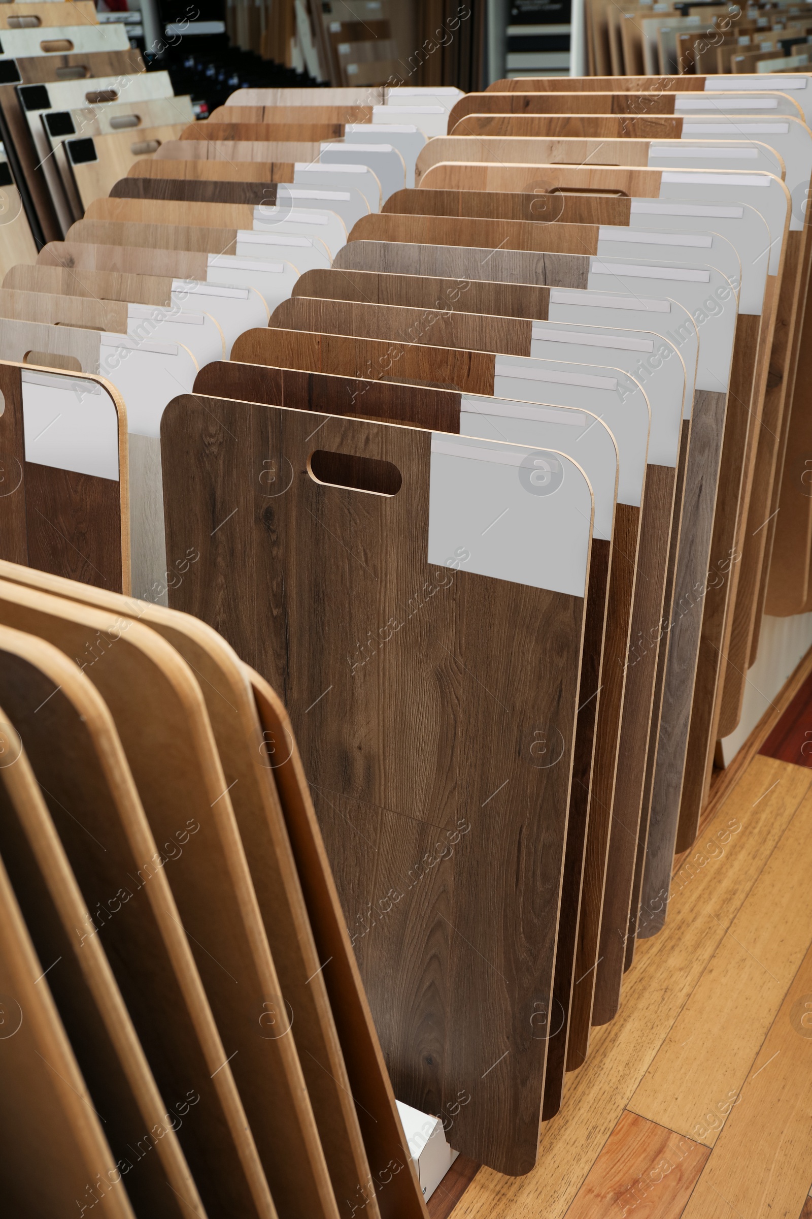 Photo of Many different samples of wooden flooring in store