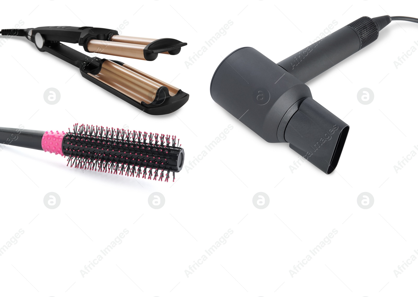 Image of Hair dryer, triple curling iron and round brush on white background