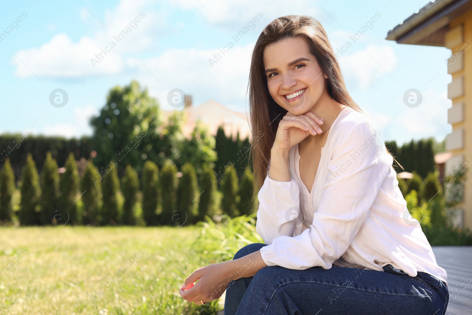 Photo of Portrait of beautiful young woman at backyard, space for text