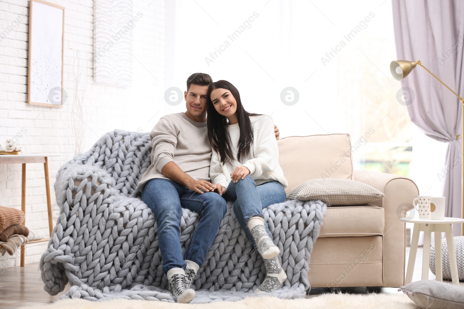 Photo of Happy couple spending time together at home. Winter vacation