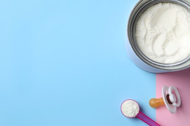 Photo of Flat lay composition with powdered infant formula on color background, space for text. Baby milk