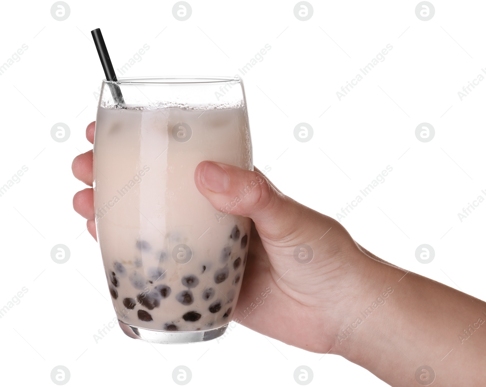 Photo of Woman holding glass of bubble milk tea with tapioca balls on white background, closeup