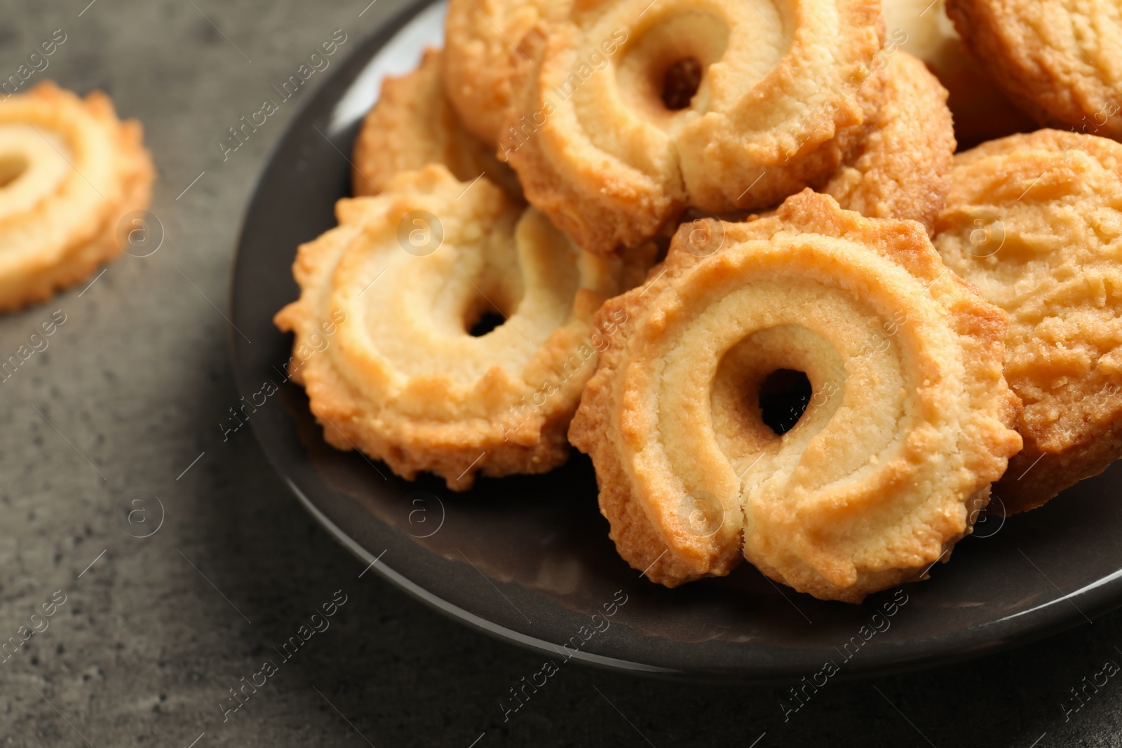 Photo of Plate with Danish butter cookies on table, closeup