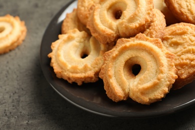 Photo of Plate with Danish butter cookies on table, closeup