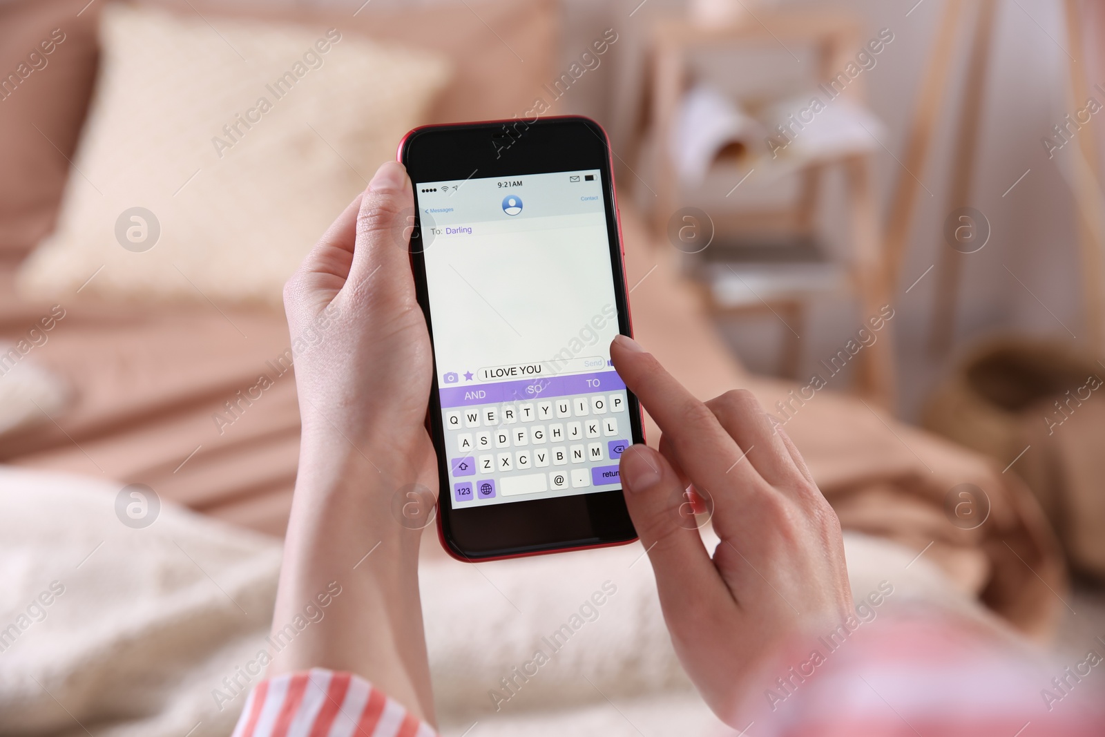 Photo of Woman sending message with text I Love You indoors, closeup