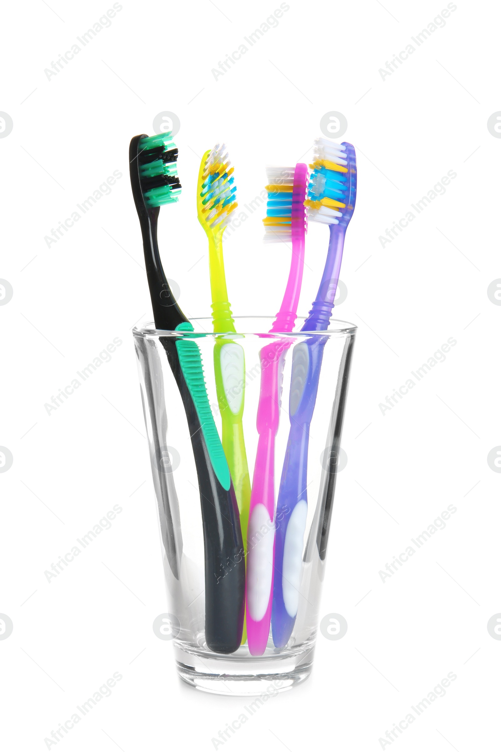 Photo of Cup with different toothbrushes on white background. Dental care