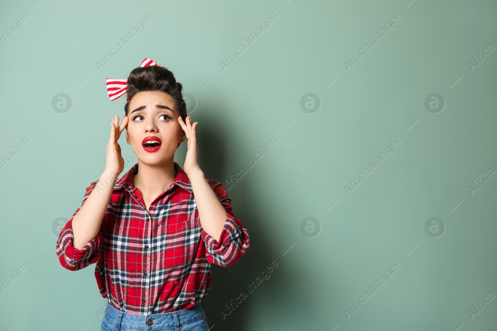 Photo of Portrait of funny bothered housewife on color background