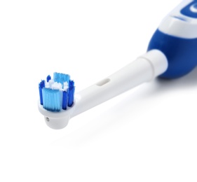 Photo of Electric toothbrush on white background. Dental care