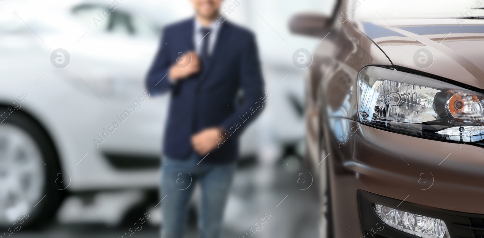 Image of Customer choosing and buying car in auto dealership, focus on new auto. Banner design