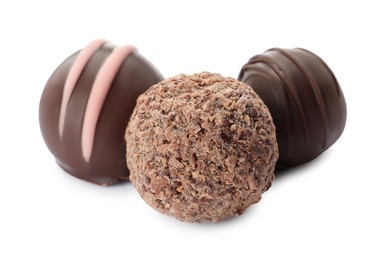 Photo of Many different delicious chocolate truffles on white background