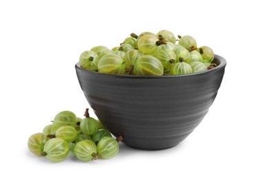 Bowl and ripe gooseberries on white background